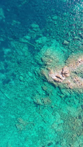 italian coast scenery, golden hour illuminates serene landscape featuring cliffs and tranquil waters. Sardinia