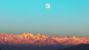 Stunning aerial view of Caucasus snowy mountains illuminated by a full moon perfectly centered in the sky. winter drone landscape captured from above. - Powered by Shutterstock - Get 15% off with code: PIKWIZARD15