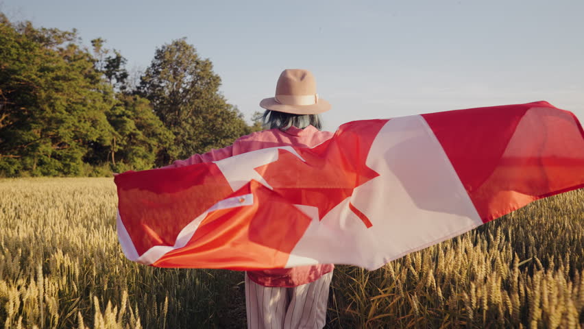 Canadian Patriot Woman Running With National Flag On Field. Red Maple, Patriotic Spirit, Symbol of Canada freedom, independence, national pride.