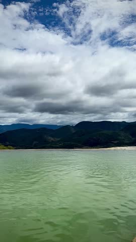 Mineral Formations and Serene Turquoise Mineral Pool Above the Mountains (Hierve el Agua, Oaxaca, Mexico)