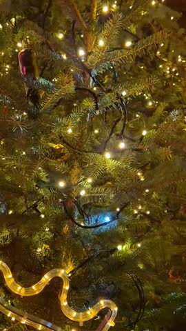 Christmas tree glittering illumination. A video of NewYear tree glowing lights.