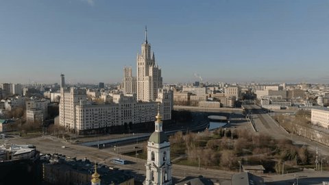 Drone Reverse Descent over Urban Riverside Skyline