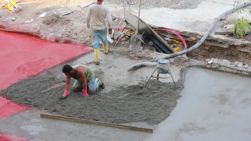 AVSALLAR, TURKEY - MAY 08, 2013: Workers at construction site makes floor of