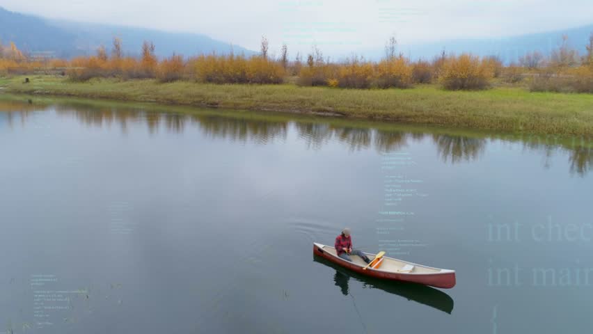 Man paddling red canoe on calm lake, stroke starting animated travel map overlaying orange trees. Watercraft, solo, paddle, autumn, overcast, tranquil, reflections