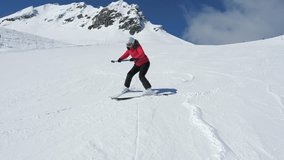 Woman skiing on bright snow. Beginner skier practicing turns on mountain under clear sky. Skier rolls down with plow technic braking with skis and learns on snow slopes in bright winter sunlight - Powered by Shutterstock - Get 15% off with code: PIKWIZARD15