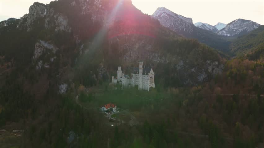 Konigsschloss Neuschwanstein, Bayern, Allgau, Deutschland. Neuschwanstein Castle Bavaria, Fussen, Germany. Front view of castle at sunrise bavarian Alps background. Castle of King Ludwig 2 of Bavaria