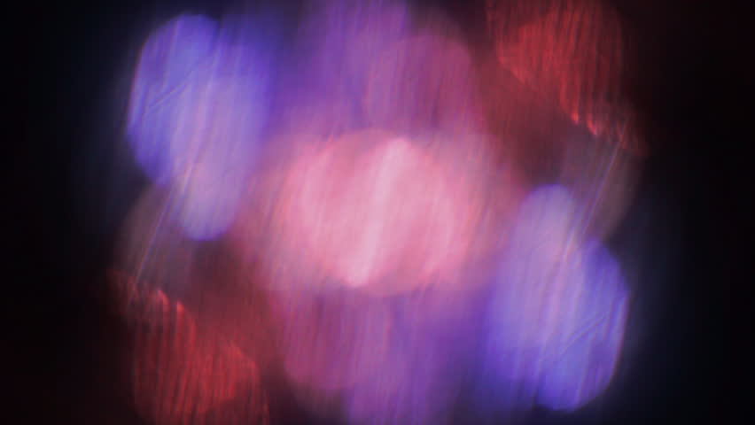 Vibrant Red and Blue Light Leak Glitch Effect on Black Background