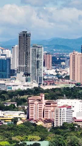 Makati City with skyscrapers and high rise towers. Metro Manila, Philippines. Vertical view.