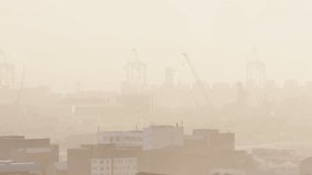 Binary sphere emerging over hazy city, centering, rotating and pulsing red digits to signal data. Orb, bits, codes, neon, harbor, skyline, cranes - Powered by Shutterstock - Get 15% off with code: PIKWIZARD15