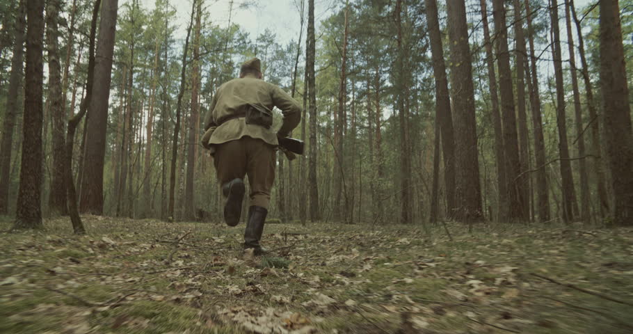 Reenactor Dressed As Russian Soviet Infantry Soldier Of World War Ii Run With Rifle Mosin Nagant. War Combat In Forest. Reenactment Tactic Game. Red Soviet Army Military Uniform.