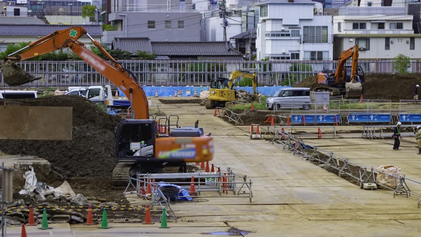 A timelapse of moving cranes at the under construction in Tokyo tilt