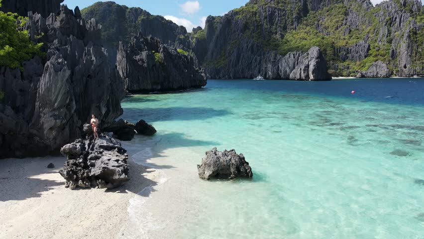 Crystal-clear turquoise waters, limestone cliffs, and white sandy beach on Shimizu Island, El Nido, Palawan, Philippines. A tropical paradise perfect for serene escapes.