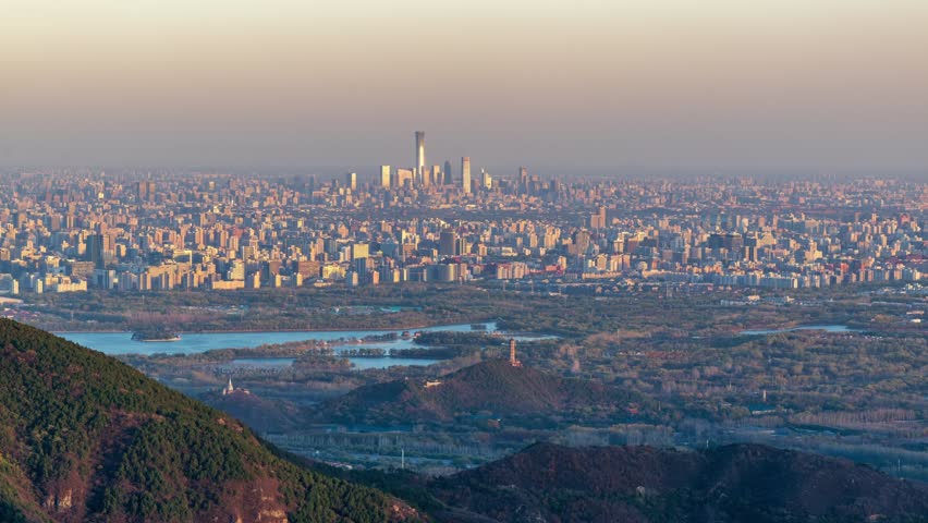 Beijing, China - 9th November 2025 - Overlooking Beijing cityscape and Summer Palace from day to night