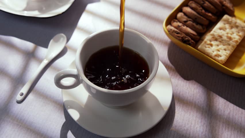 Rich Brewed Coffee Slowly Pours Into A Cup, Creating A Warm Aroma and Gentle Atmosphere that Brings Comfort, Focus, and Calm To The Early Hours Of The Day