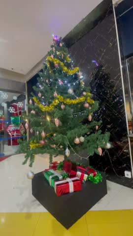 Shining Christmas Tree Filled with Ornaments and Lights