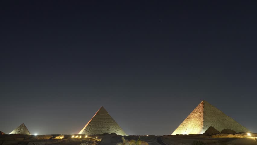 View of great pyramid complex at midnight in Egypt
