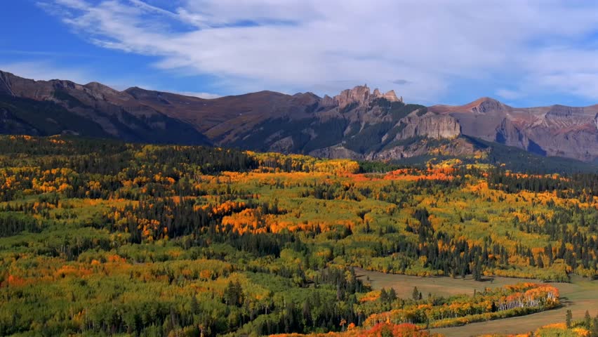 Crested Butte Ohio Kebler Pass Colorado aerial drone The Castle Mountain Mill rock Castle Gunnison National Forest morning autumn fall Aspen tree colors blue sky cloud farmland parallax downward