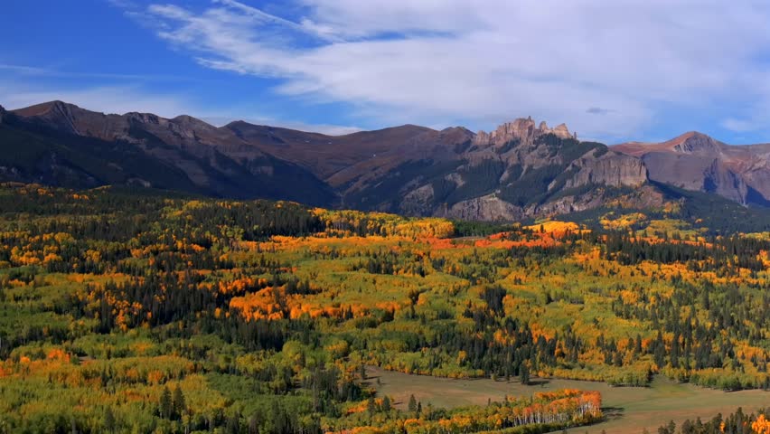 Crested Butte Ohio Kebler Pass Colorado aerial drone The Castle Mountain Mill rock Castle Gunnison National Forest morning autumn fall Aspen tree colors blue sky cloud farmland parallax circle left