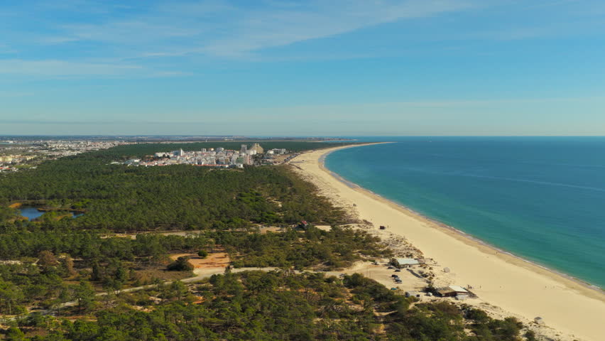 Sunny Aerial of Monte Gordo Town and Praia Verde Beach Horizon