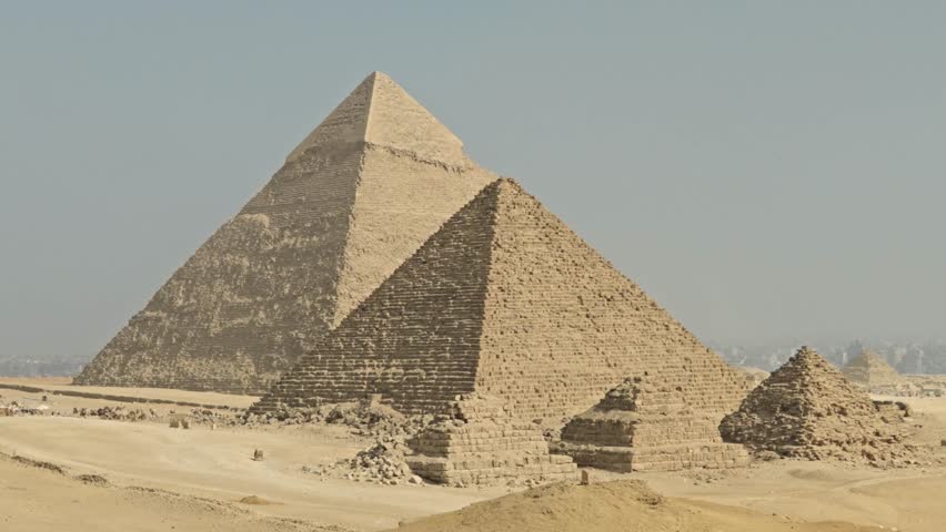 A panorama of the Giza Necropolis featuring the three principal pyramids built for Pharaohs Khufu, Khafre, and Menkaure, surrounded by the desert landscape.