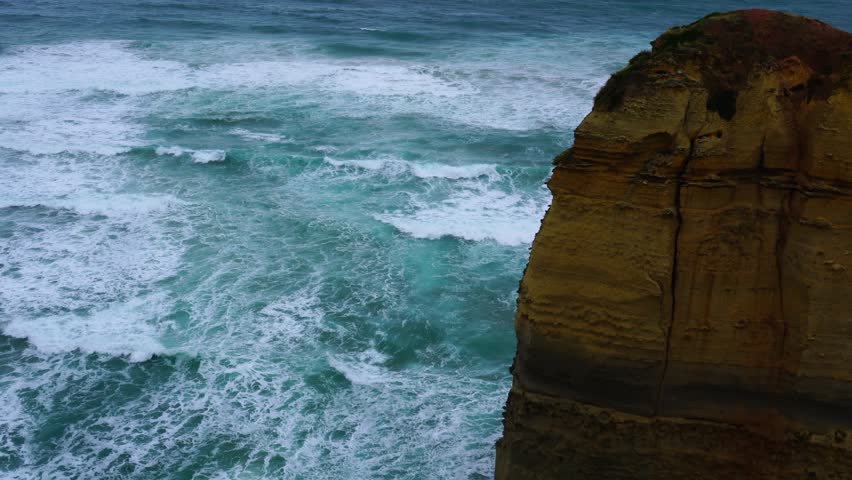 View of rock cliff and the surf at the Twelve Apostles or Twelve Rocks in Port Campbell National Park, Melbourne, Victoria, Australia.