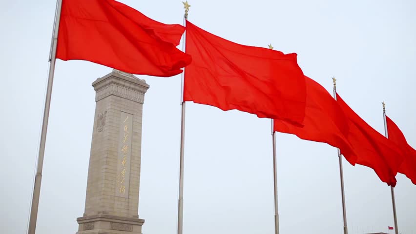 Red flags flying in Tiananmen Square, Beijing, China with the Forbidden City in the background, iconic landmark, historic site, cultural heritage, patriotic scene, panoramic view