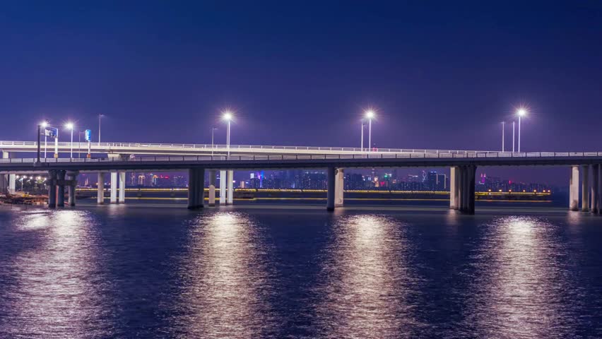 Aerial view of Shenzhen Bay Bridge, China spanning the water, modern architecture, urban skyline, connecting cities, panoramic view, iconic infrastructure, coastal cityscape