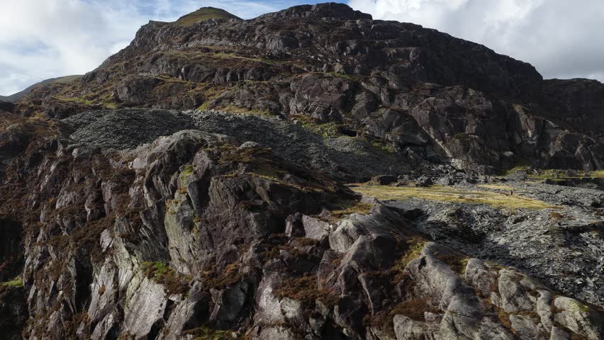 Aerial video of the rugged mountain landscape around Llyn Cwmorthin in Snowdonia National Park, showcasing dramatic Welsh terrain, natural wilderness, and scenic highland beauty.