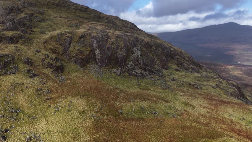 Aerial drone video showcasing the rugged highland landscapes of Snowdonia in North Wales, capturing dramatic mountains, natural wilderness, and sweeping scenic beauty.