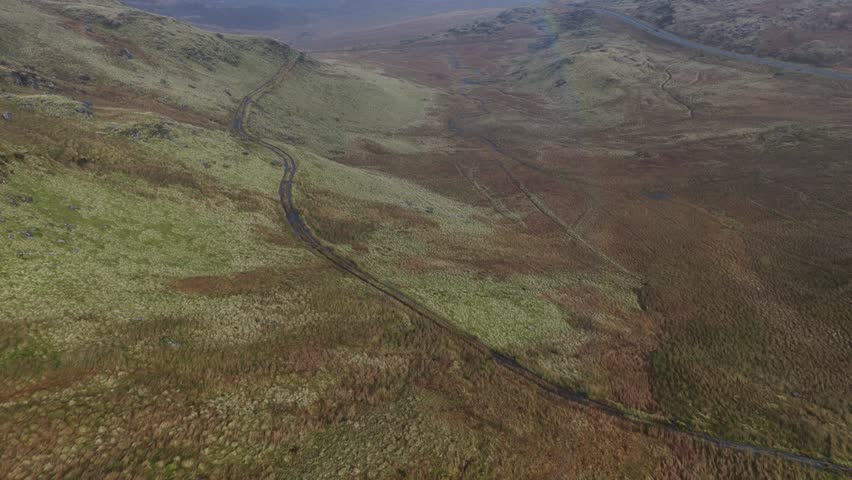 Aerial drone video showcasing the rugged highland landscapes of Snowdonia in North Wales, capturing dramatic mountains, natural wilderness, and sweeping scenic beauty.