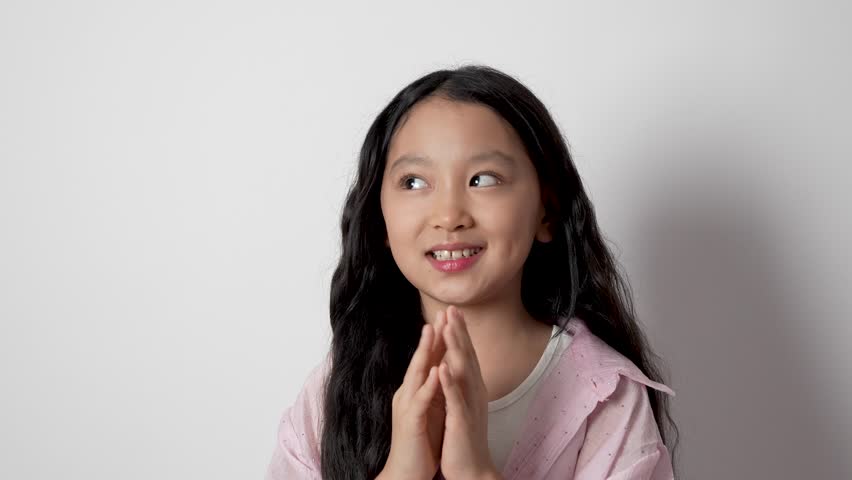 Young girl smiling and talking in a cheerful manner