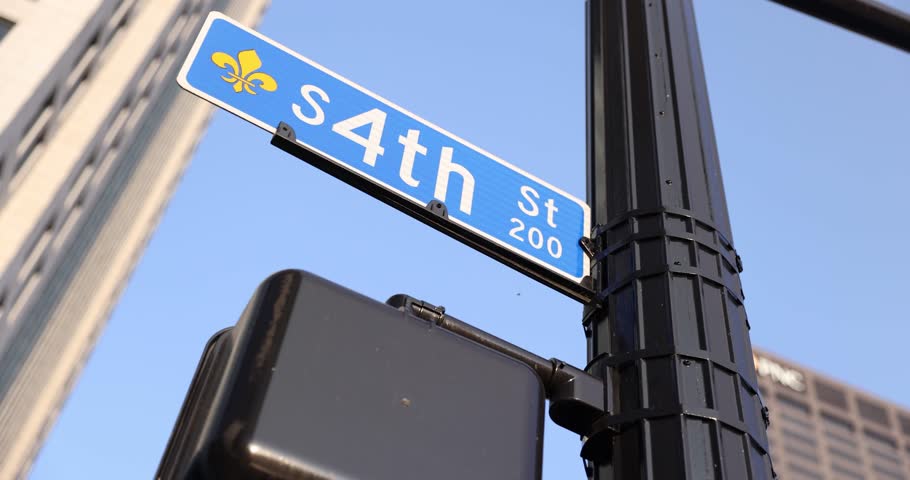 Shot of a “4th St” street sign in downtown Louisville, Kentucky. Captures urban navigation and a well-known area of the city.