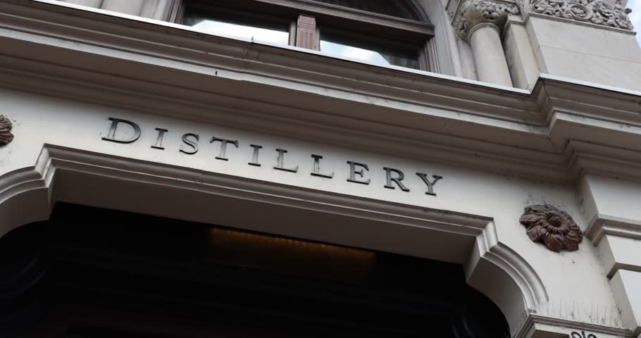 Exterior shot of a building marked “Distiller” in downtown Louisville. Highlights the city’s connection to bourbon heritage and tourism culture.