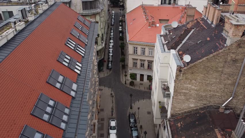 Aerial view of orange rooftops and a street, Hungary.