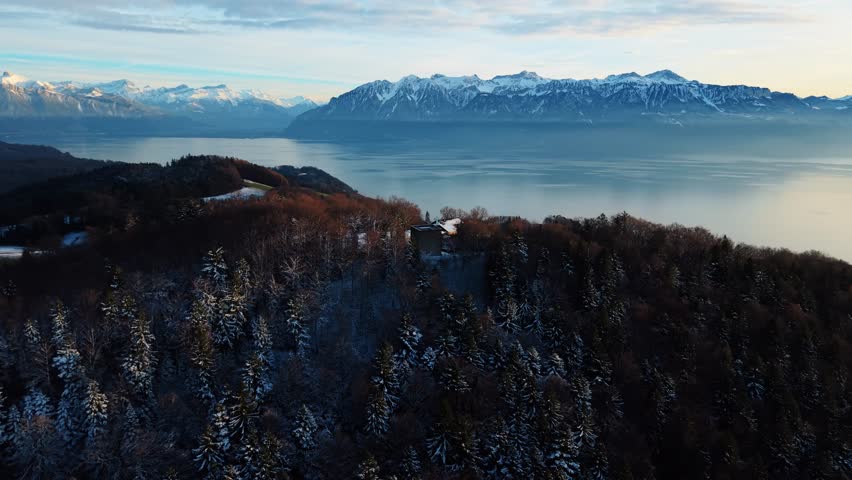 Aerial view of Gourze Tower and snow capped mountains, Switzerland.