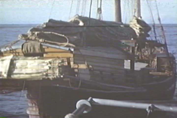 1950s - A submarine crew blows up wooden fishing boats