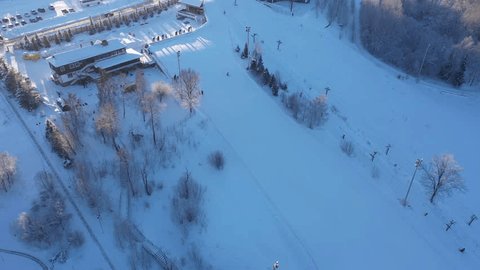 Drone Pitching Down Capture Snowy Ski Run