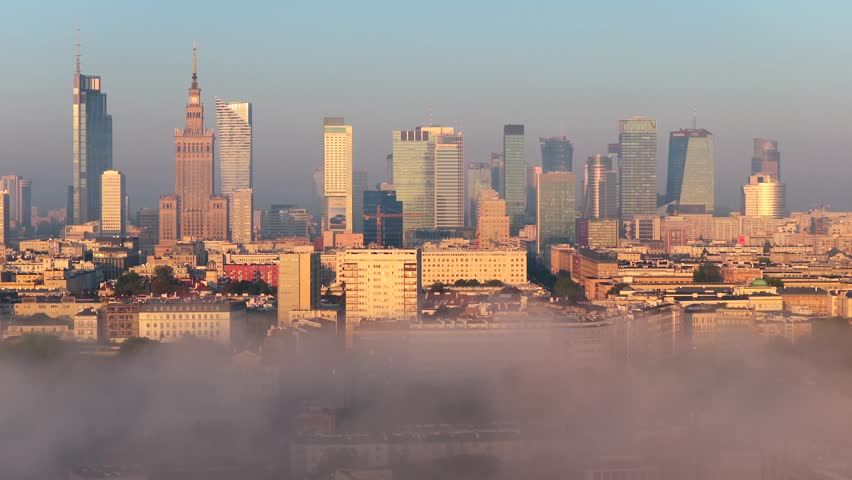 Warsaw skyline view with fog, featuring the Palace and Varso Tower