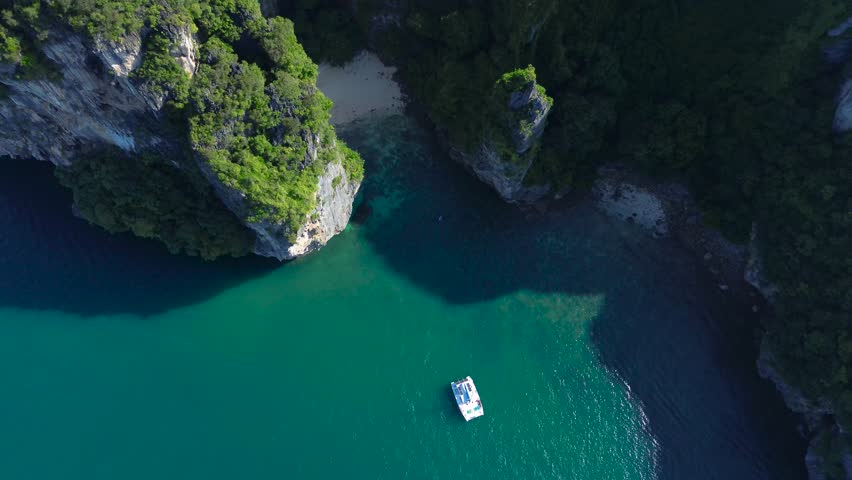 Popular places in Thailand, travel around Thailand. Poda Island, a secret lagoon behind the island. A sailing yacht near the island, a view from above.