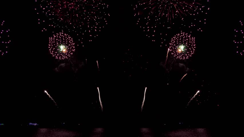 Amazing beautiful colorful firework display over sea on celebration night. Fireworks show for happy new year, 4k footage.	
