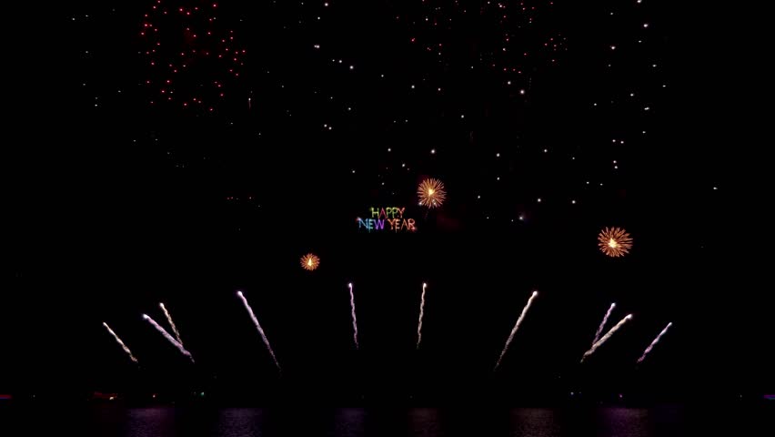 Amazing beautiful colorful firework display over sea on celebration night. Fireworks show for happy new year, 4k footage.	
