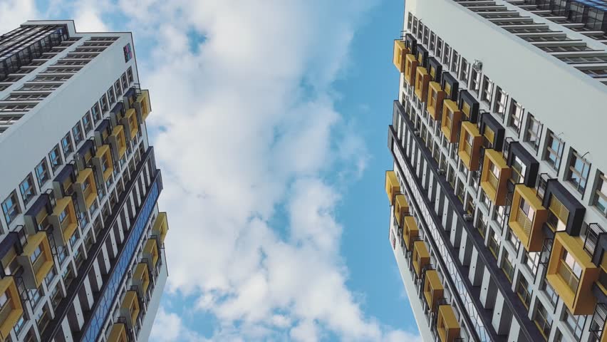 sun glare on the wall, sunbeams on the house, sun glare on the windows, beautiful play of light on the house, multi-storey house, multi-storey houses on a sunny day, large windows, very beautiful hous