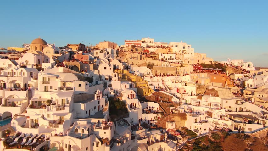 4K cinematic drone footage of Oia, Santorini at sunset - Greece_010