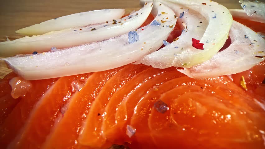 Close up of delicious smoked salmon with onion and black salt