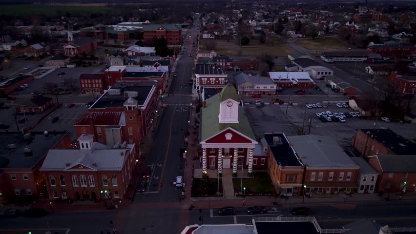 Christmas lights shine bright in Charles Town aerial, West Virginia at dusk. The town shows its holiday spirit with festive decorations.