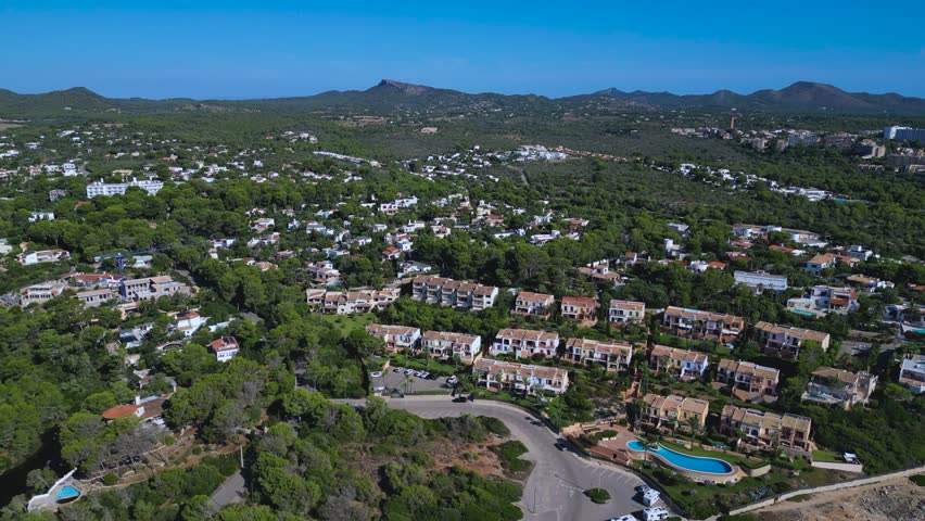 Real estate developments near Cala Murada in Mallorca, Balearic Islands. Highlights private villas, hotels, and the natural beauty of the Mediterranean coastal landscape.