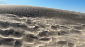 High-contrast shot of windblown sand. Portraying movement, change, and raw natural power. Weather reports or travel promotion. - Powered by Shutterstock - Get 15% off with code: PIKWIZARD15
