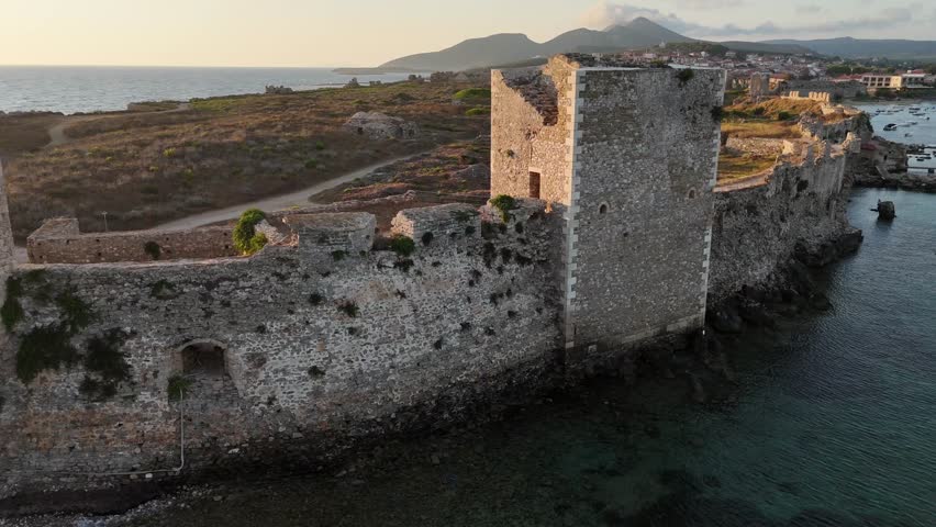 Methoni,Messenia,Peloponnese,Aerial view slight circle pan left around Methoni Castle Towers by the seaduring sunset.