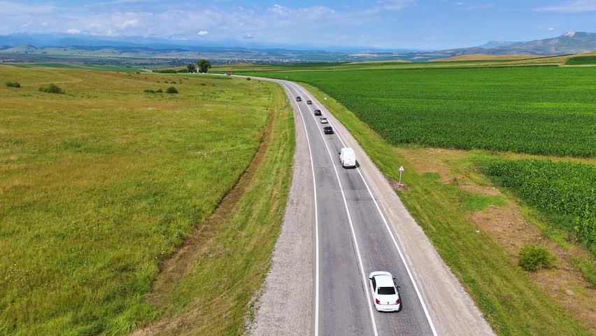 a road in the countryside among green hills