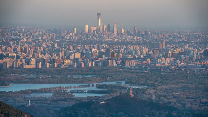 Beijing, China - 9th November 2025 - Overlooking Beijing cityscape and Summer Palace from day to night